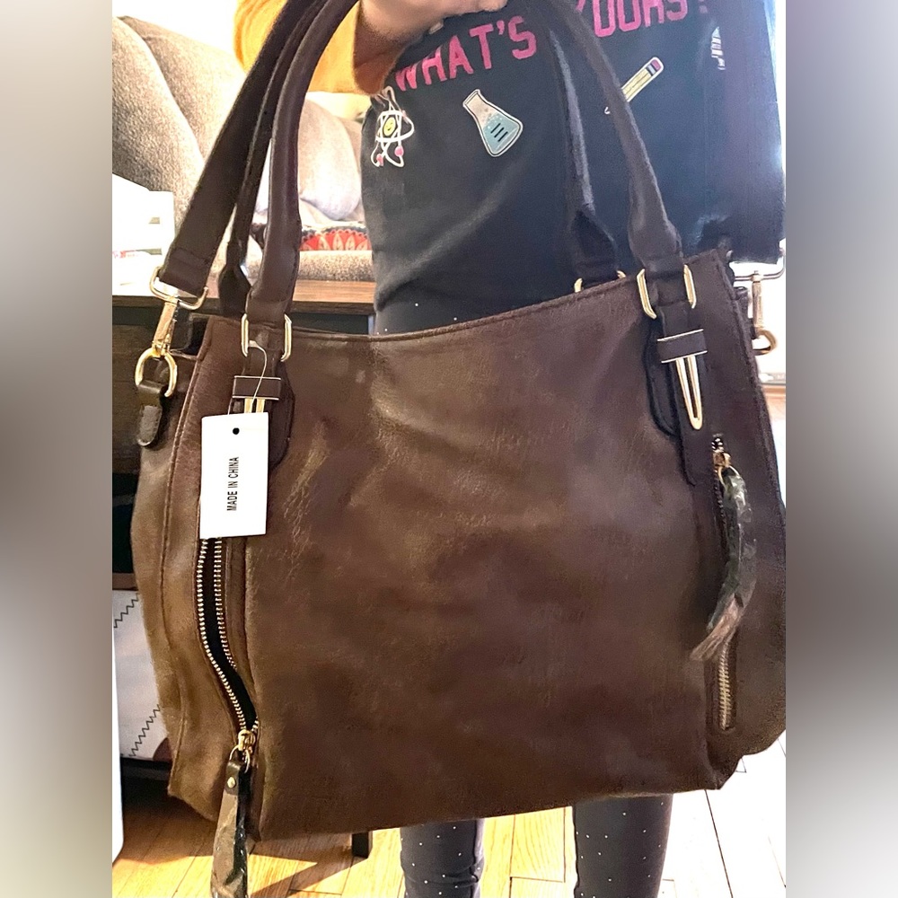 Brand new brown bag/purse. In perfect condition.